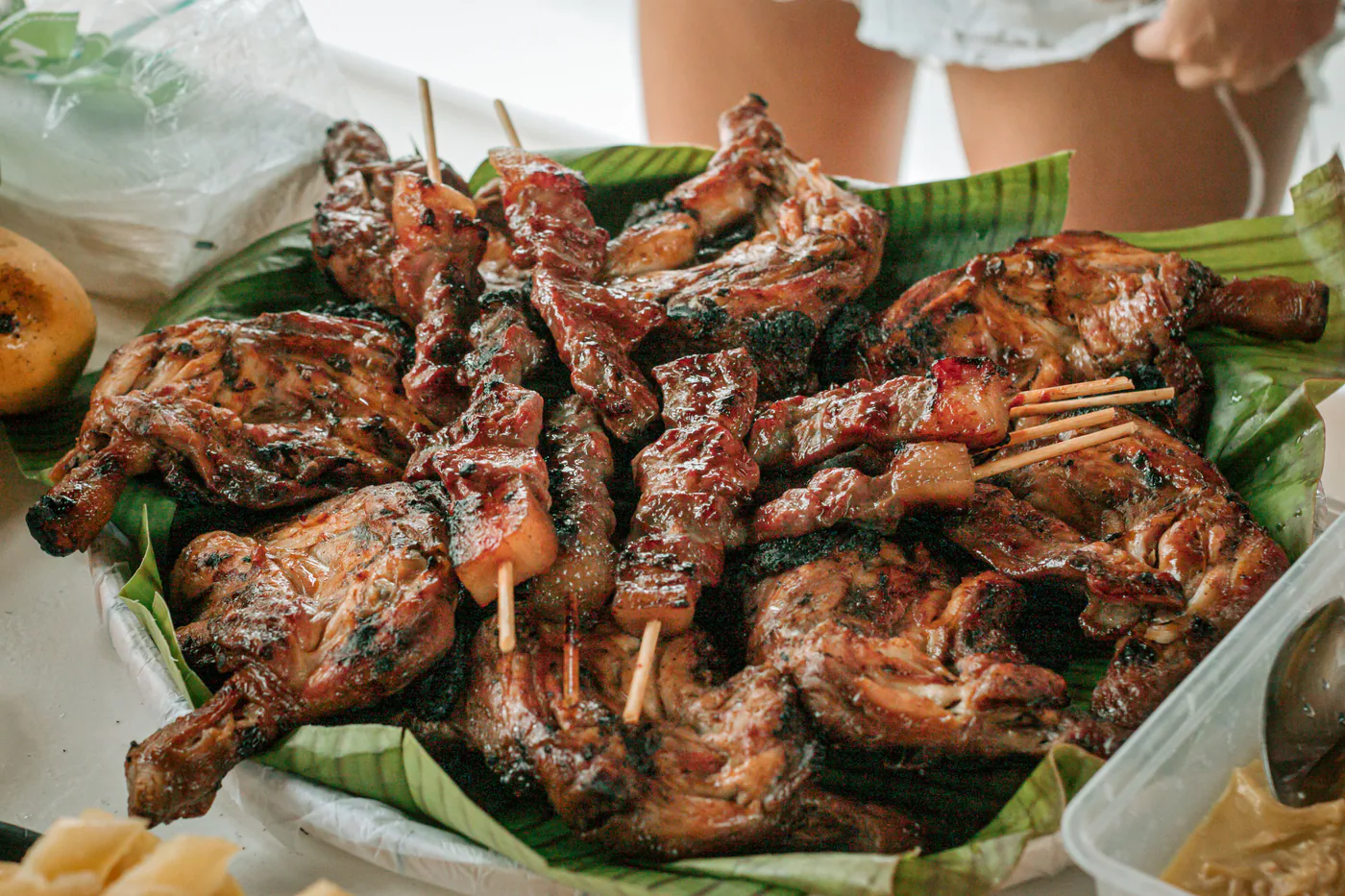 A large platter of grilled chicken and meat skewers ready to share